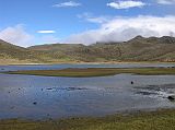 Ecuador Cotopaxi 01-05 Laguna Limpiopungo The weather cleared a bit as we drove past Laguna Limpiopungo (3830m), with Ruminahui (4712m) behind in the clouds.